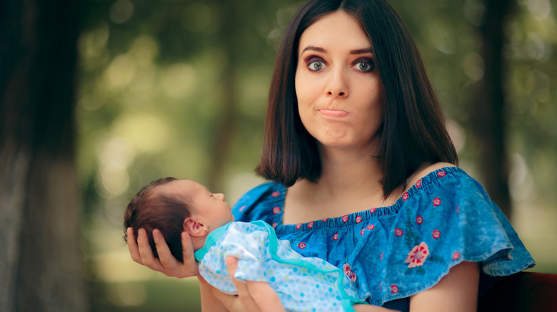 Woman holding a newborn baby