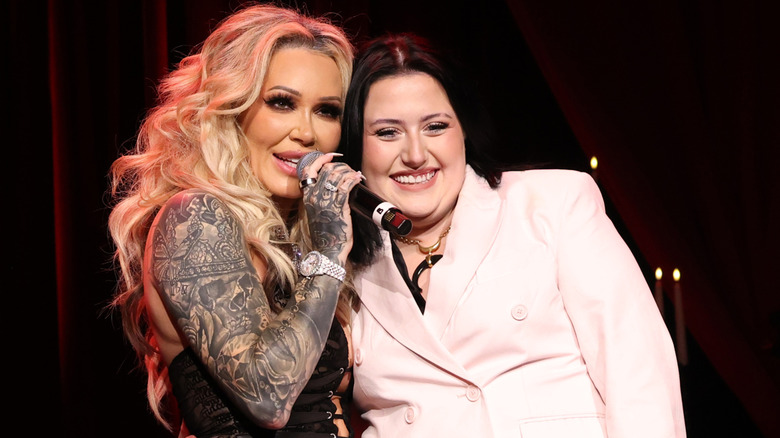 Bunnie Xo speaking in microphone with Bailee Ann DeFord