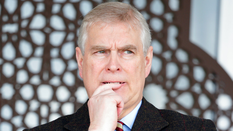 Closeup of Prince Andrew biting his finger