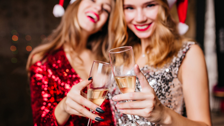 Women laughing while toasting