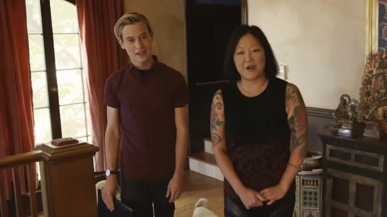 Tyler Henry and Margaret Cho walking through her house