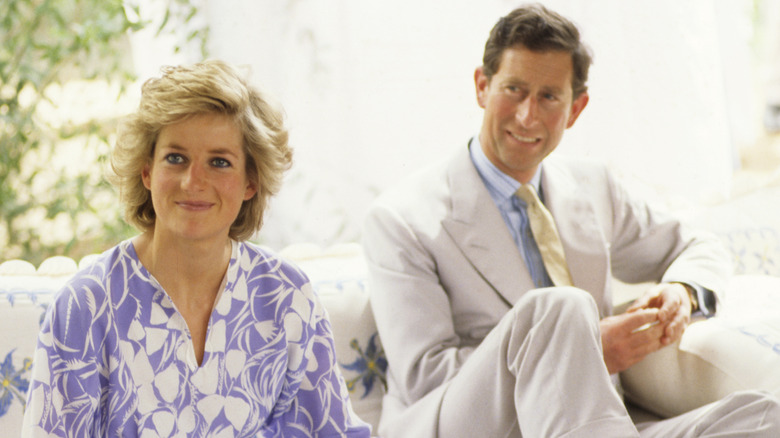 Princess Diana and Prince Charles smile at an event