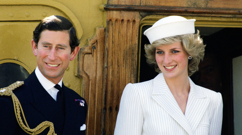 Princess Diana and Prince Charles smile on a boat