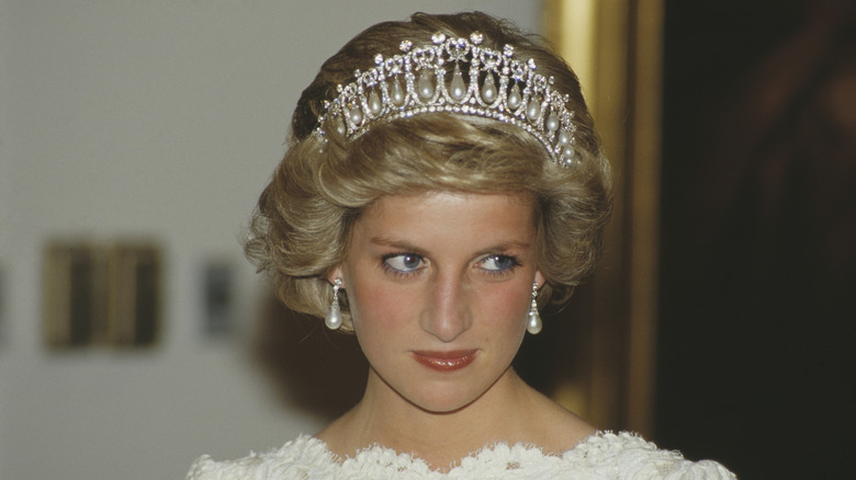 Princess Diana wears a tiara and pearl earrings