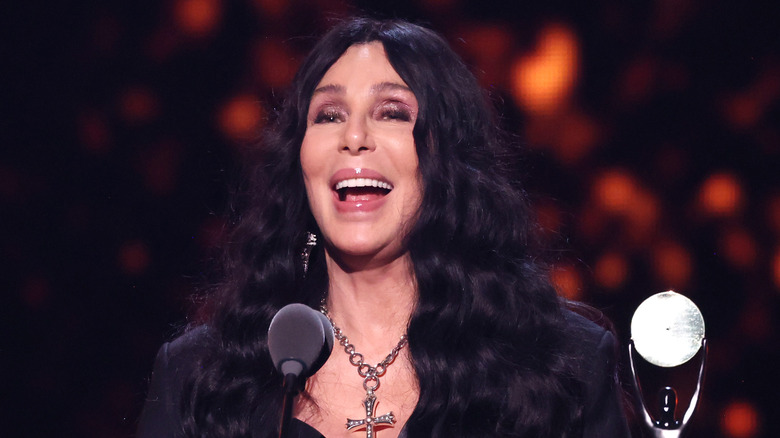 Cher receiving an award at the 2024 Rock and Roll Hall of Fame Induction ceremony