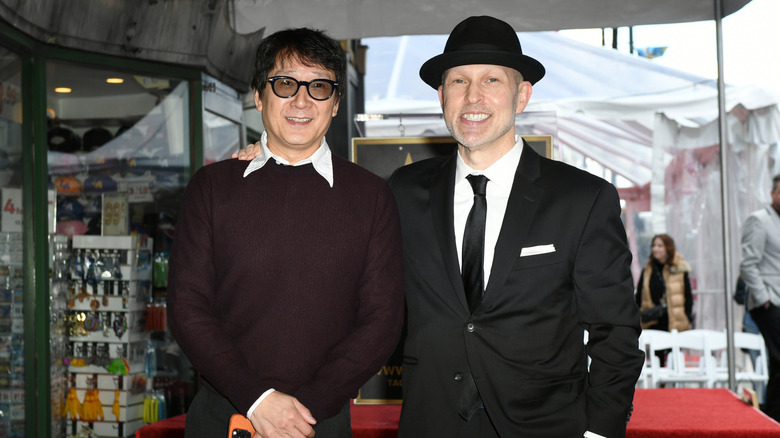Ke Huy Quan and Jeff Cohen on the red carpet smiling