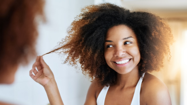 Woman touching her afro