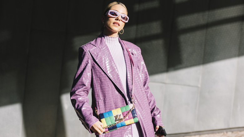 Woman in lively lavender outfit