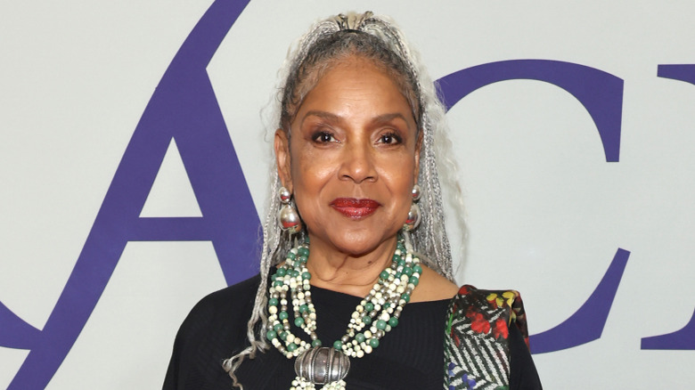 Phylicia Rashad posing and smiling at an event.