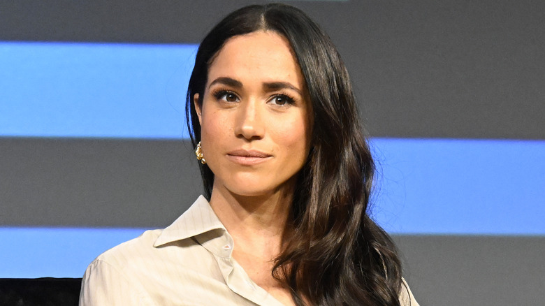 Meghan Markle staring from stage