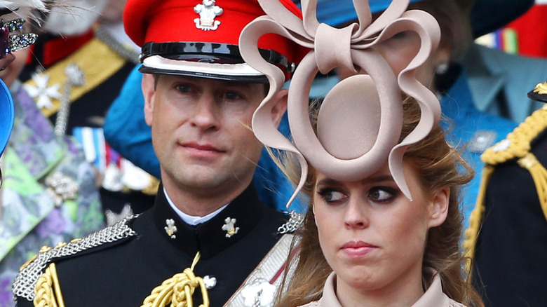 Prince Edward stands behind Princess Beatrice