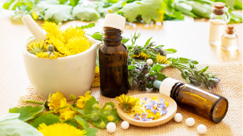 Dandelions and empty serum bottles