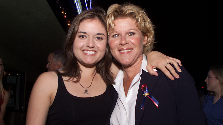 Danica McKellar with her arm around Alley Mills at  "Jane White Is Sick & Twisted" 2001 screening.