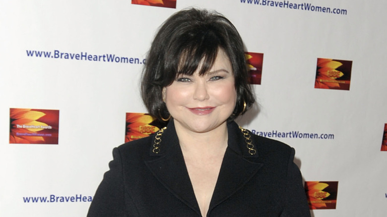 Delta Burke smiling, posing
