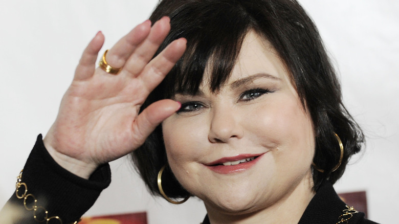 Delta Burke waving