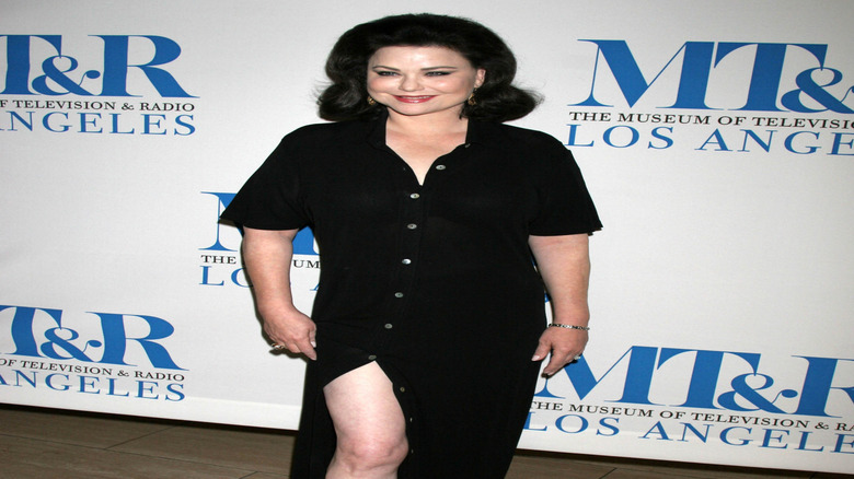 Delta Burke smiling, posing