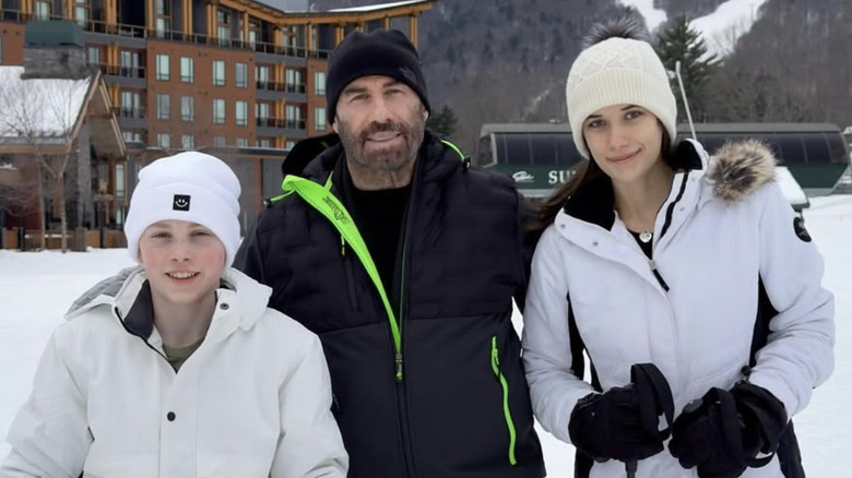 Ben Travolta posing for a photo with his sister and dad