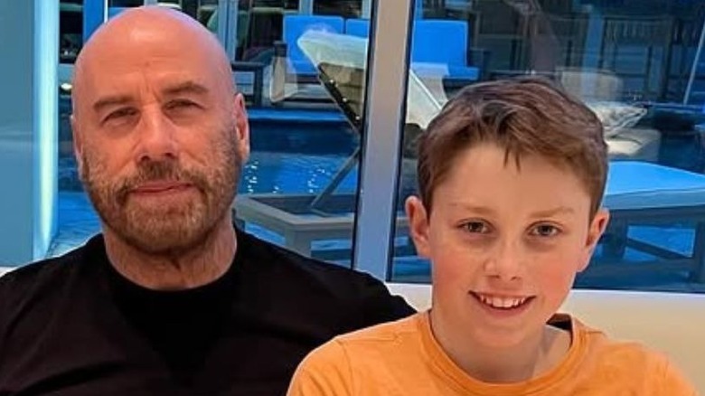 John Travolta sitting with his kids