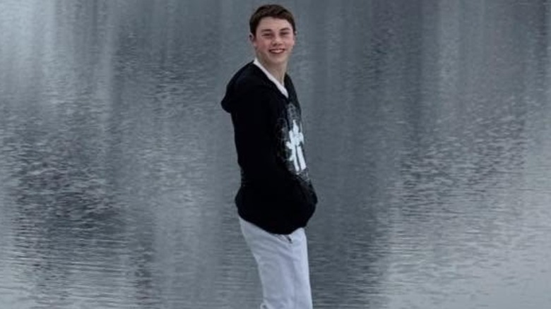 Ben Travolta standing on a rock