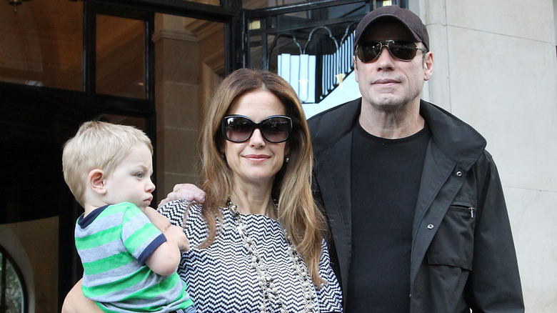 Kelly Preston holding her son Ben Travolta