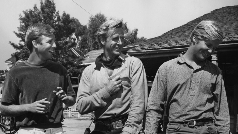 Lloyd Bridges with his sons Beau (left) and Jeff (right) on a Western film set, circa 1975.