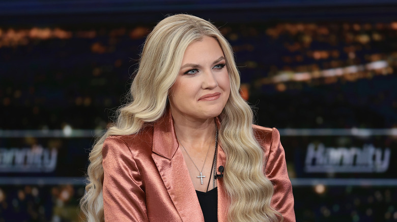 Erika Kirk wearing a satin blazer