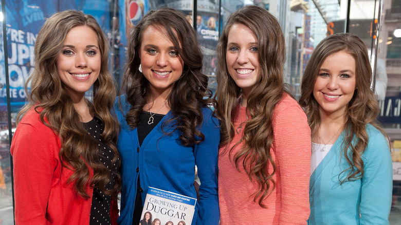 The Duggar sisters pose at an event