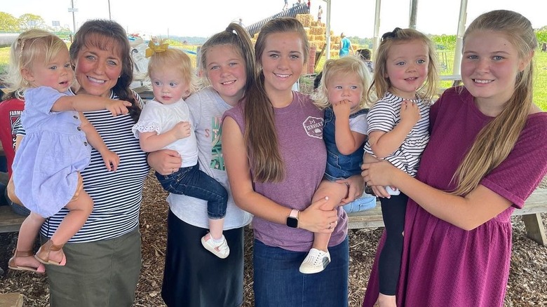 The Duggar women pose with their children
