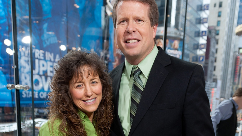 Jim Bob and Michelle Duggar cuddle up at an event