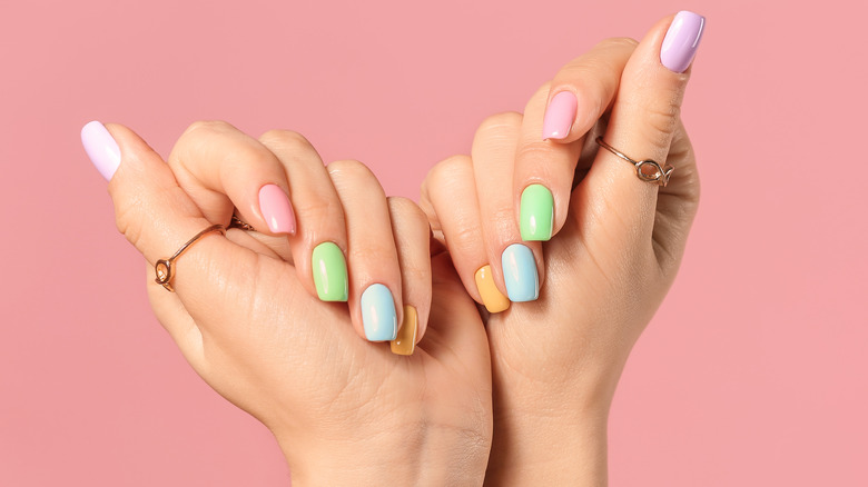 Colorful nails on two hands