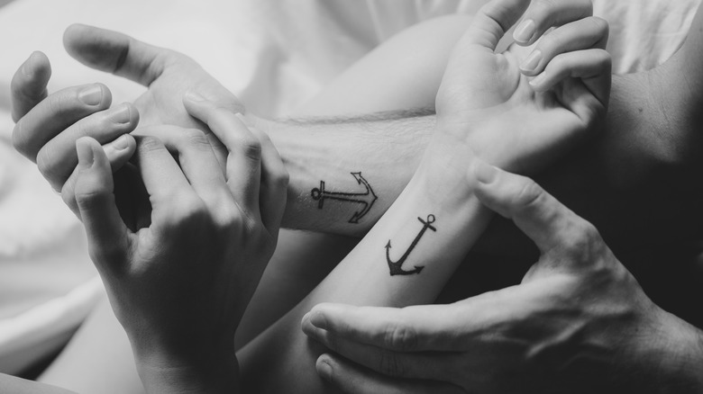 Anchor tattoos man and woman 