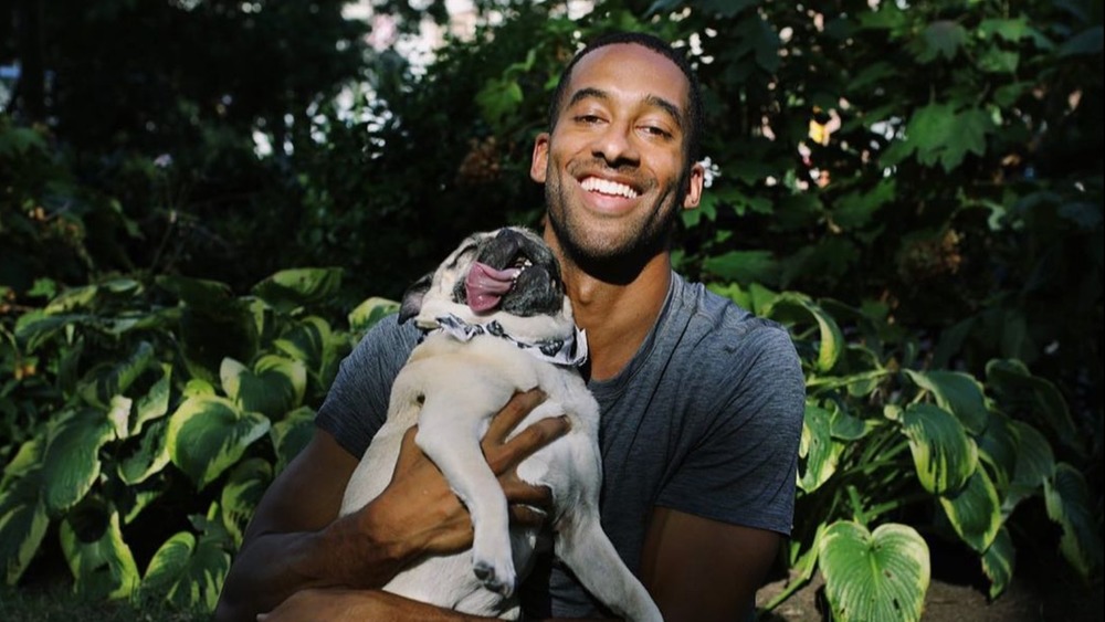 Bachelor Matt James poses with his adorable pug