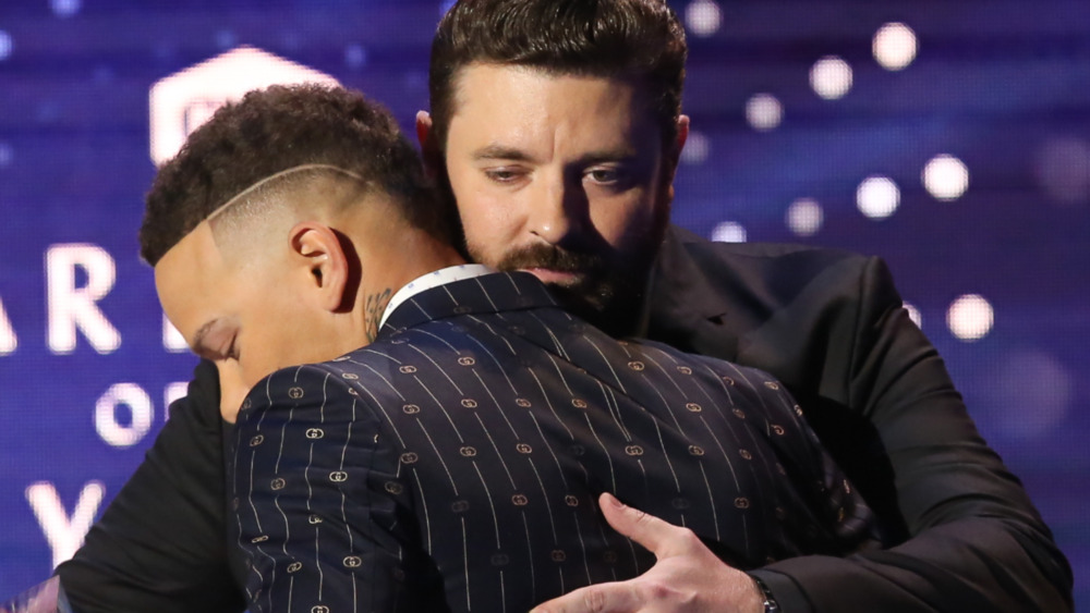 Chris Young hugging Kane Brown