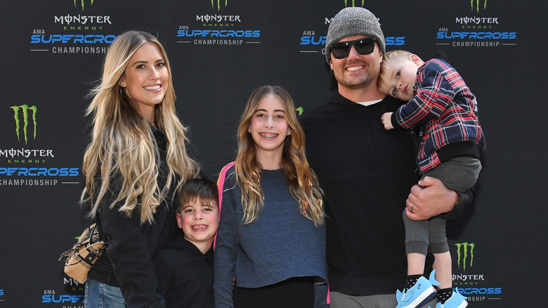 Christina Hall and Josh Hall pose with her three kids 