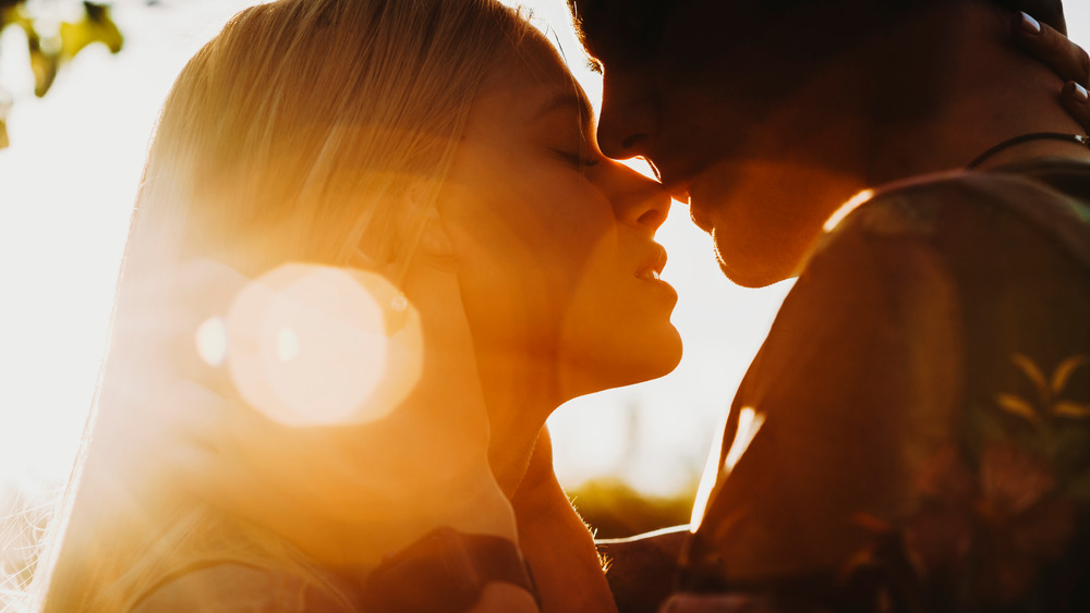 Man and woman nearing kiss