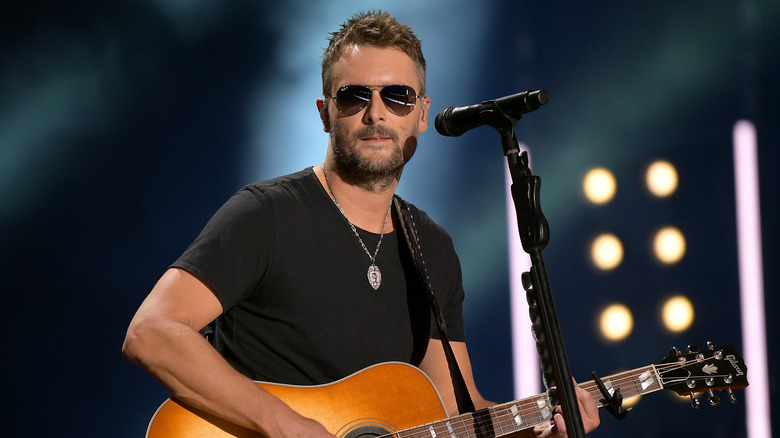 Eric Church performing in black t-shirt