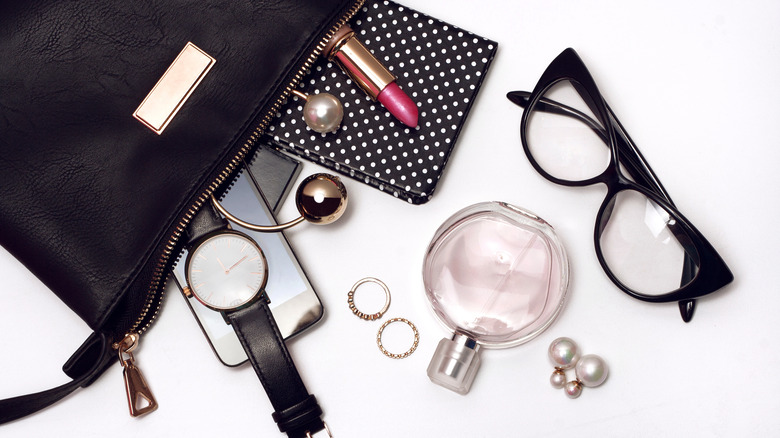 accessories spilling out of a black bag