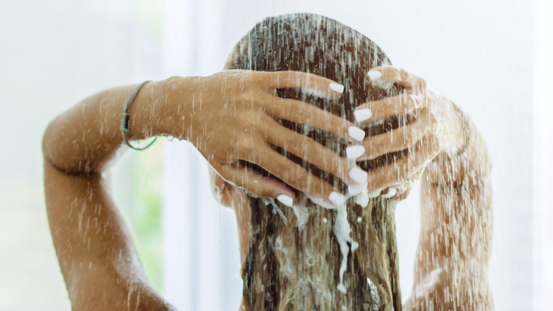 woman washing hair back view
