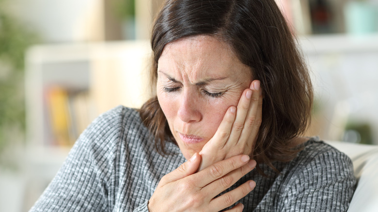 Woman with face pain 