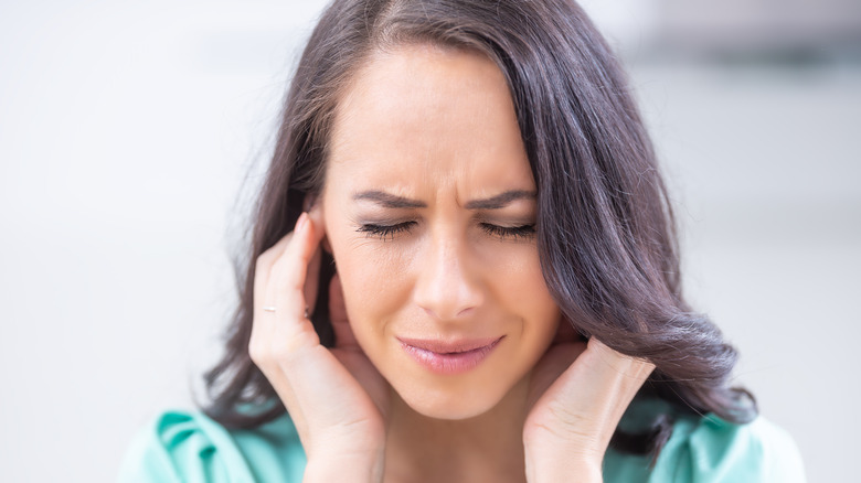 Woman's ear burning 