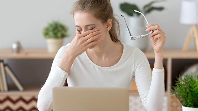 Woman experiencing eye strain