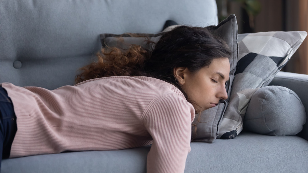 Woman sleeping on a couch