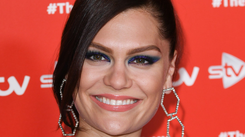 Jessie J smiling on a red carpet