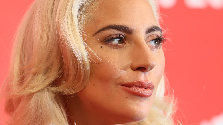 Lady Gaga smiles on red carpet