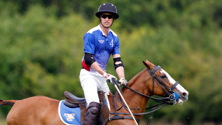 Prince William on a horse during a polo match
