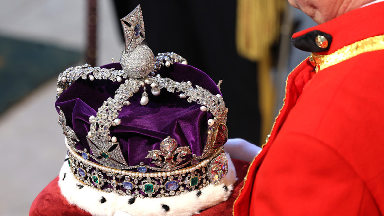 Royal handler holding the Imperial State Crown