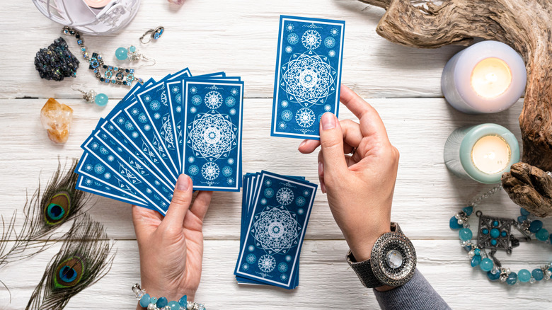 Tarot card spread with blue cards