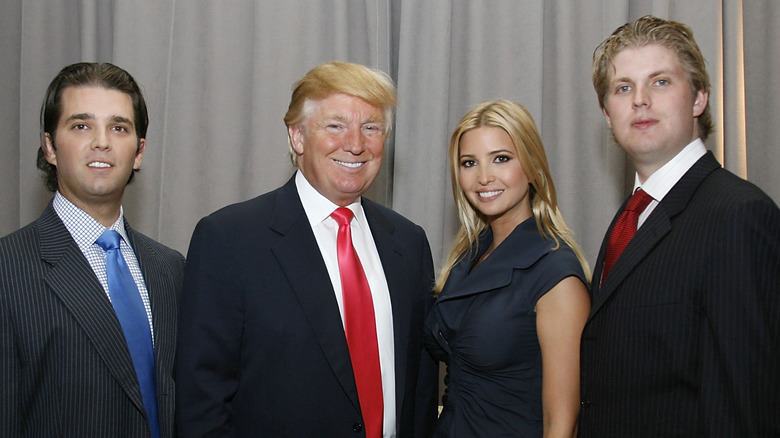 Donald Trump posing with Don Jr, Ivanka, and Eric