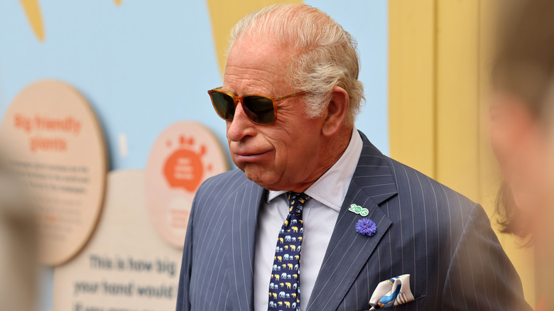 King Charles III at the London Zoo wearing sunglasses