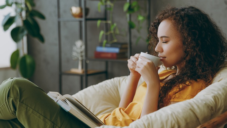 Woman sitting quietly drinking coffee